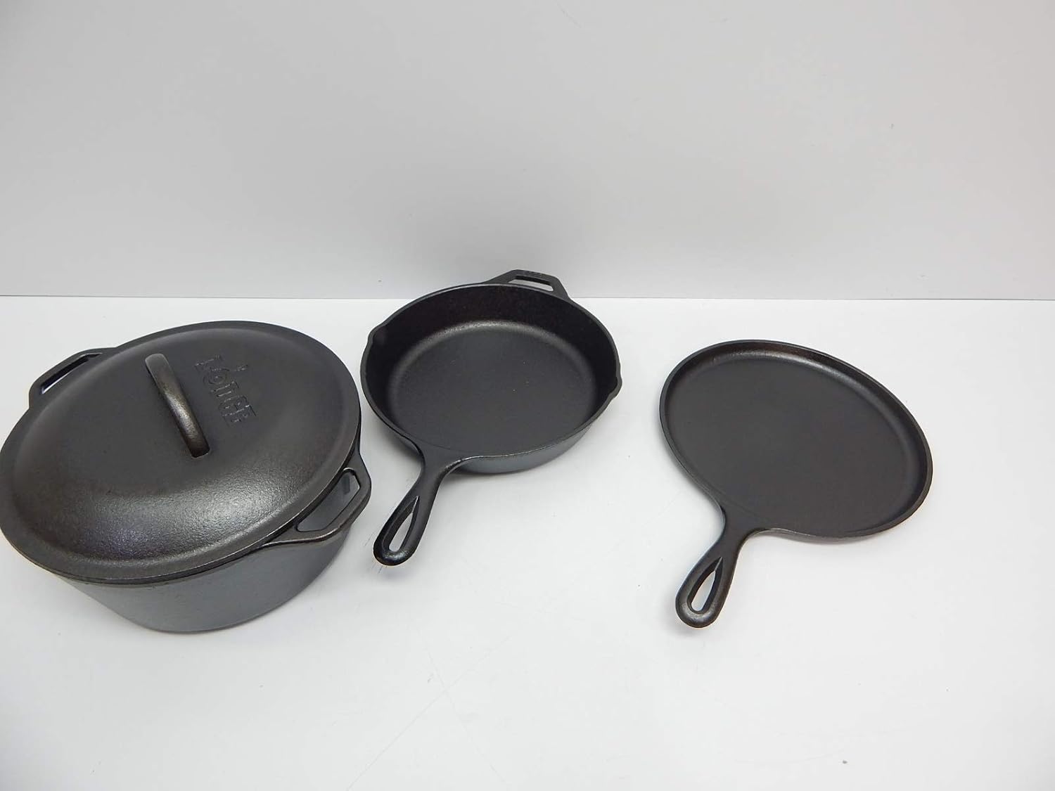 Lodge Cast Iron Set - Pre-Seasoned Kitchen Set - Skillet, Griddle & Dutch Oven Included - PFAS-Free Non-Toxic Cookware - 4-Piece Set
