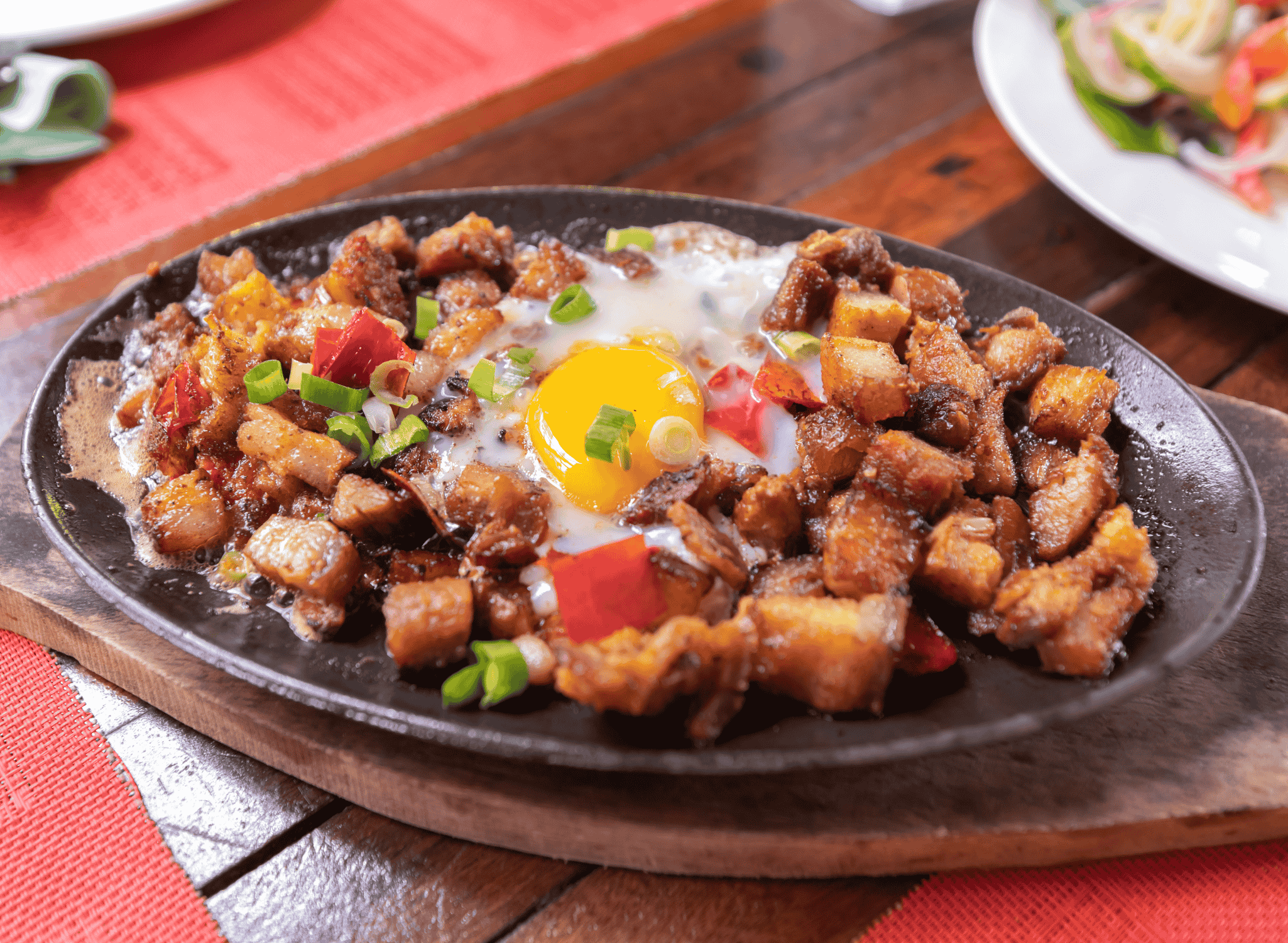 Pan-Fried Pork Sisig with Sizzling Onions and Chili