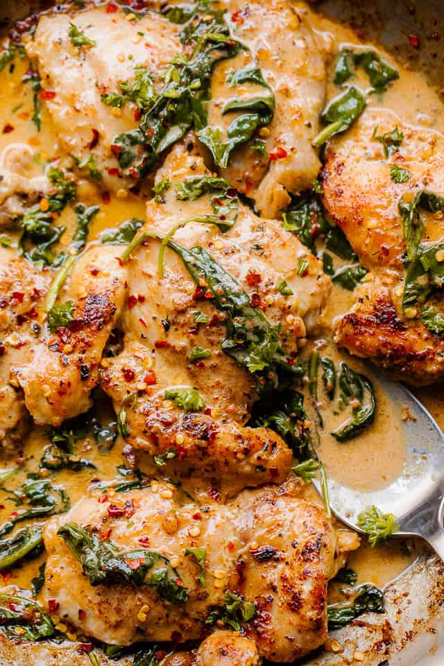 Baked Herb-Crusted Chicken Thighs with Creamed Spinach