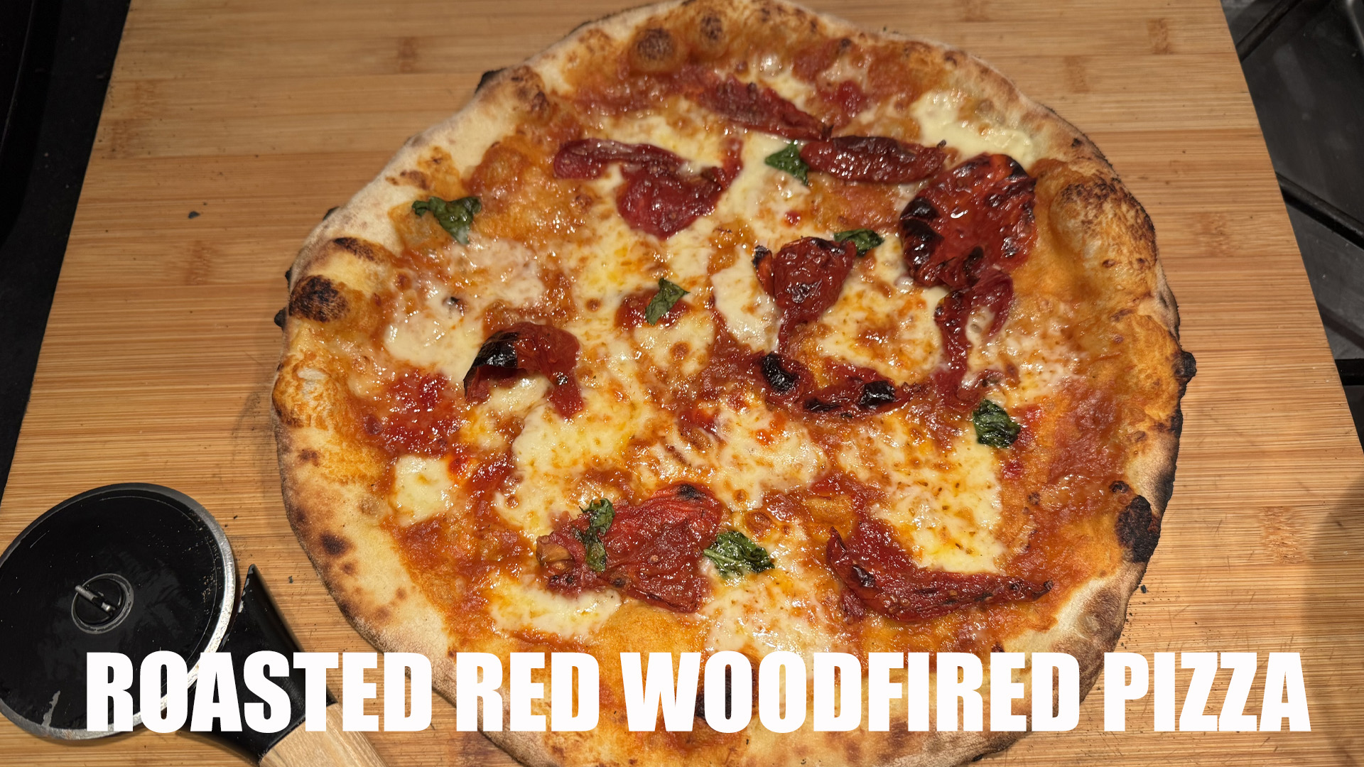 Wood-Fired Pizza with Spicy Sausage and Roasted Red Peppers