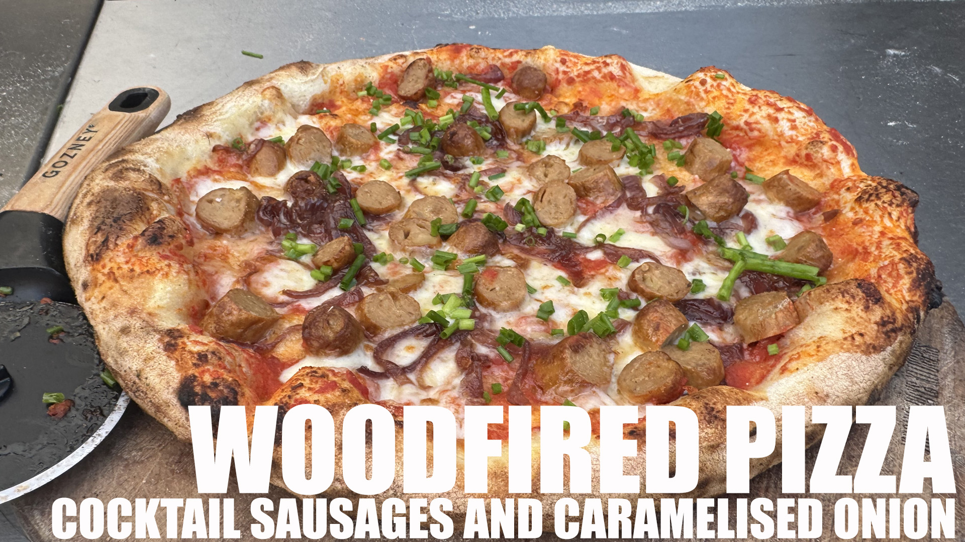 Wood-Fired Pizza with Smoky Sausage and Caramelized Onions