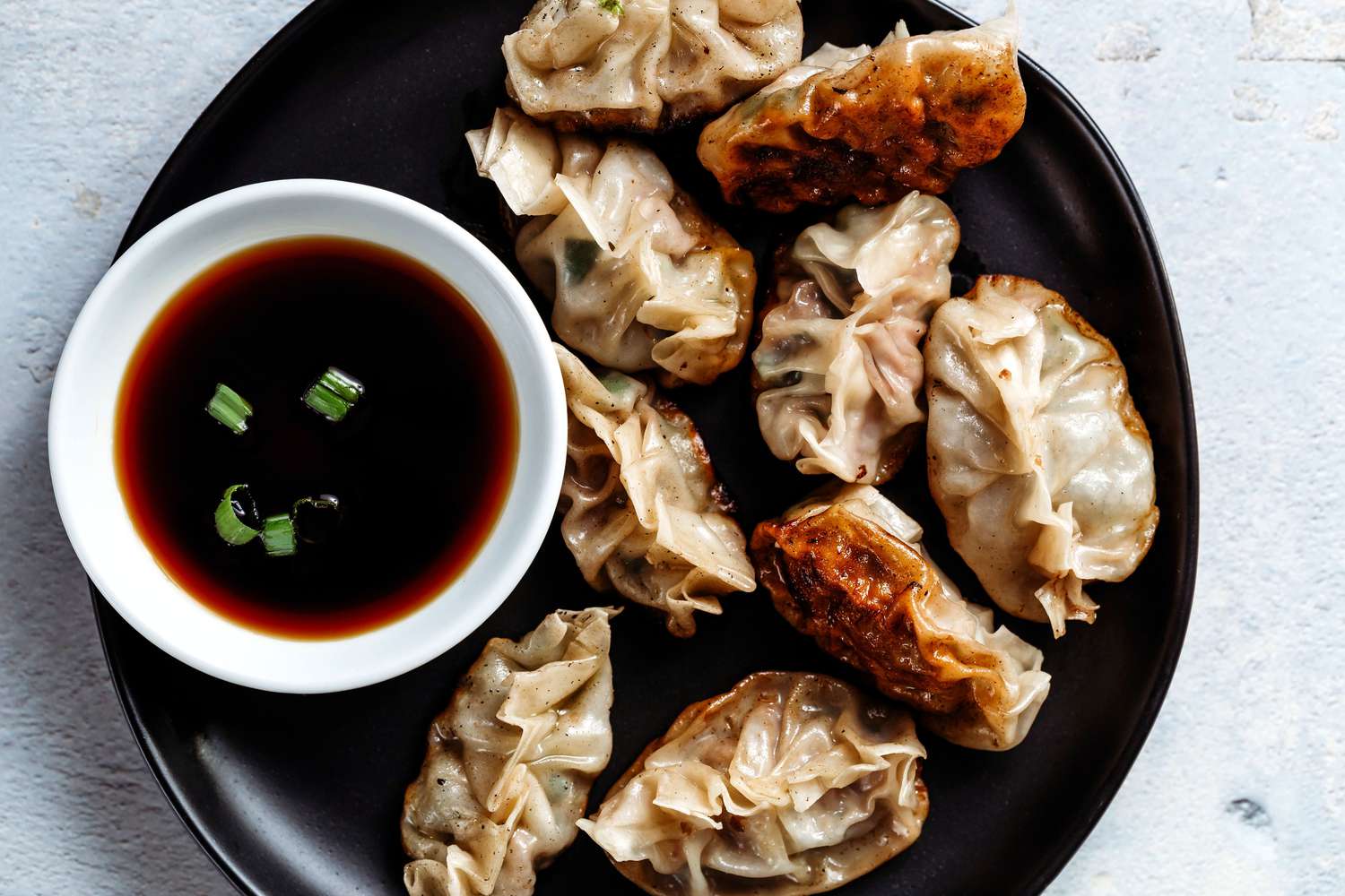 Pan-Fried Pork Dumplings with Ginger and Scallion Dipping Sauce