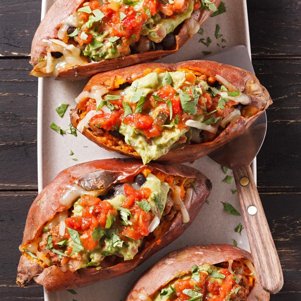 Taco-Stuffed Sweet Potatoes with Avocado Crema