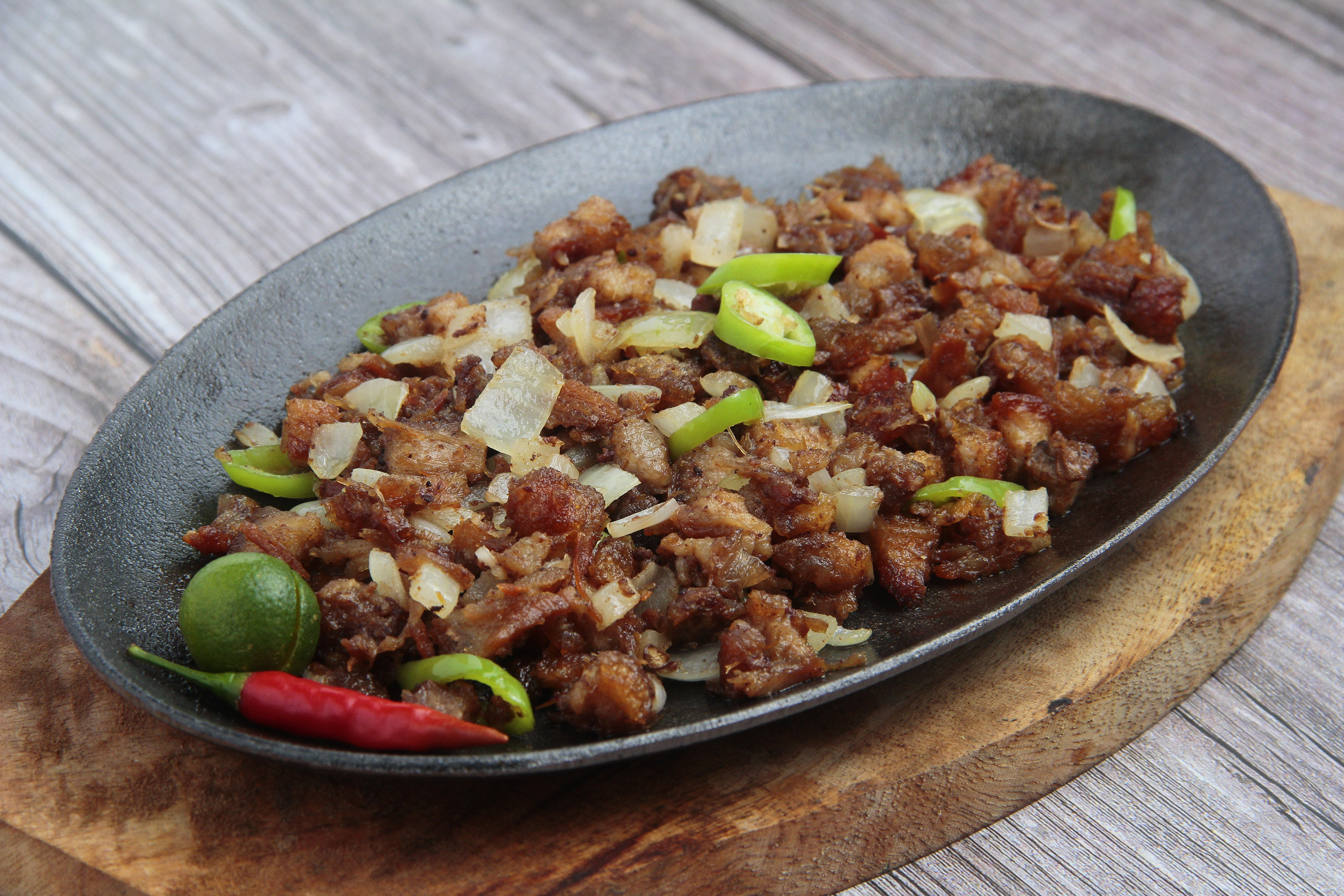 Pan-Fried Pork Sisig with Onions and Chili