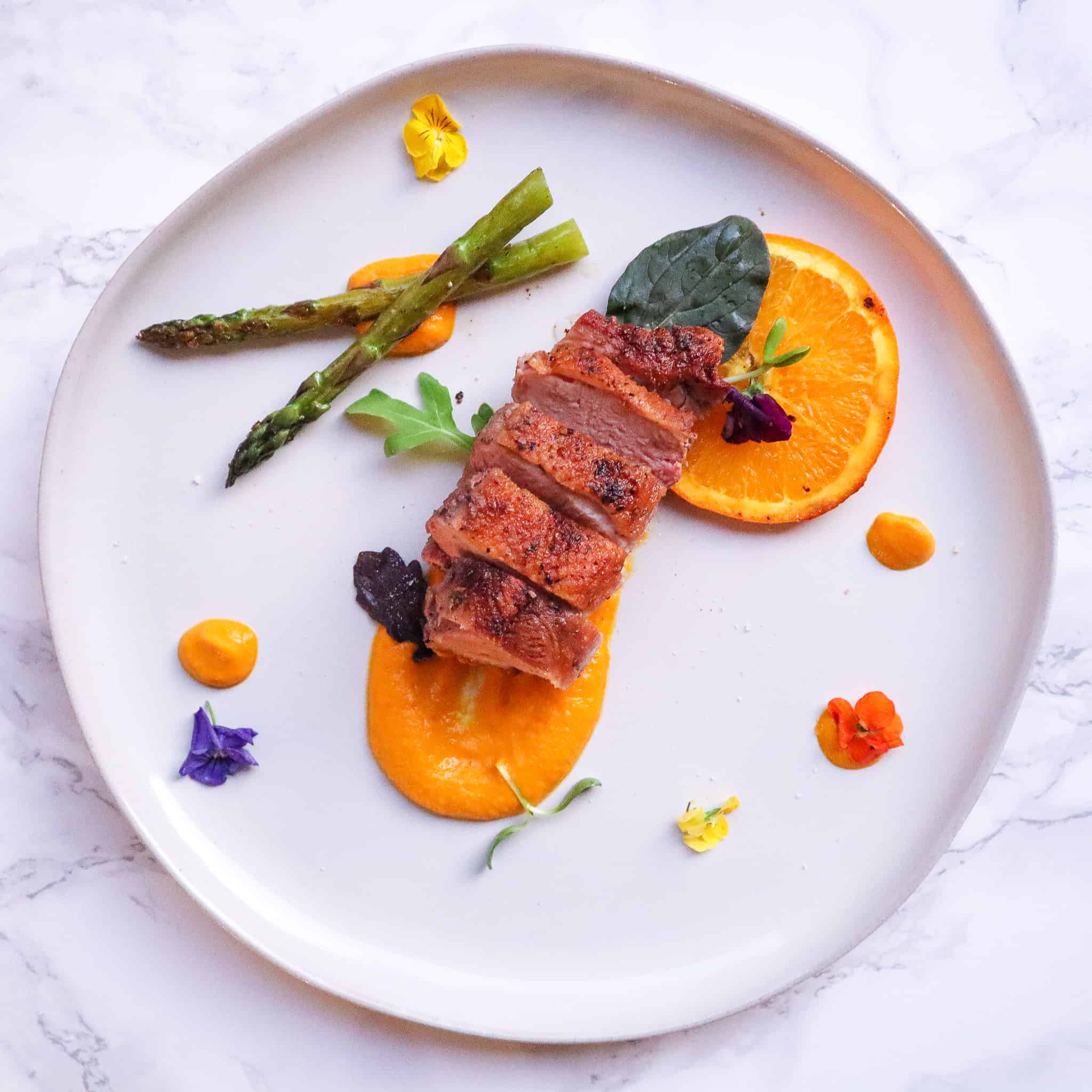 Pan-Seared Duck Breast with White Asparagus and Strawberry Gastrique