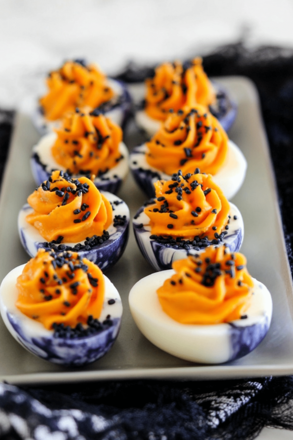 Black and Orange Halloween Deviled Eggs with Harissa Mayo
