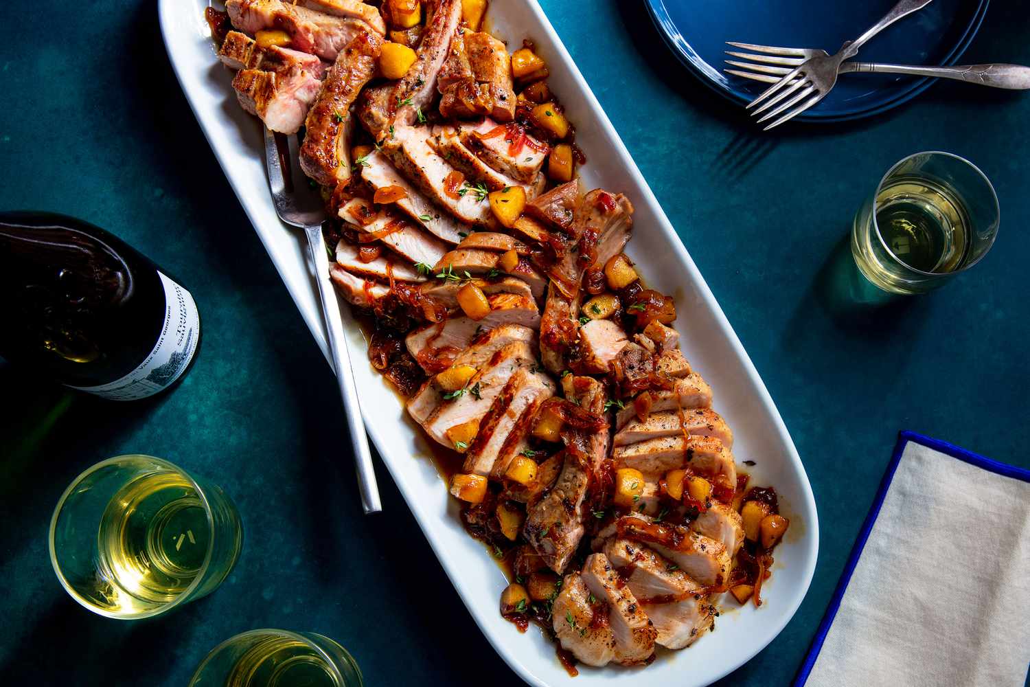 Pan-Seared Pork Chops with Apple Cider Reduction and Sautéed Kale