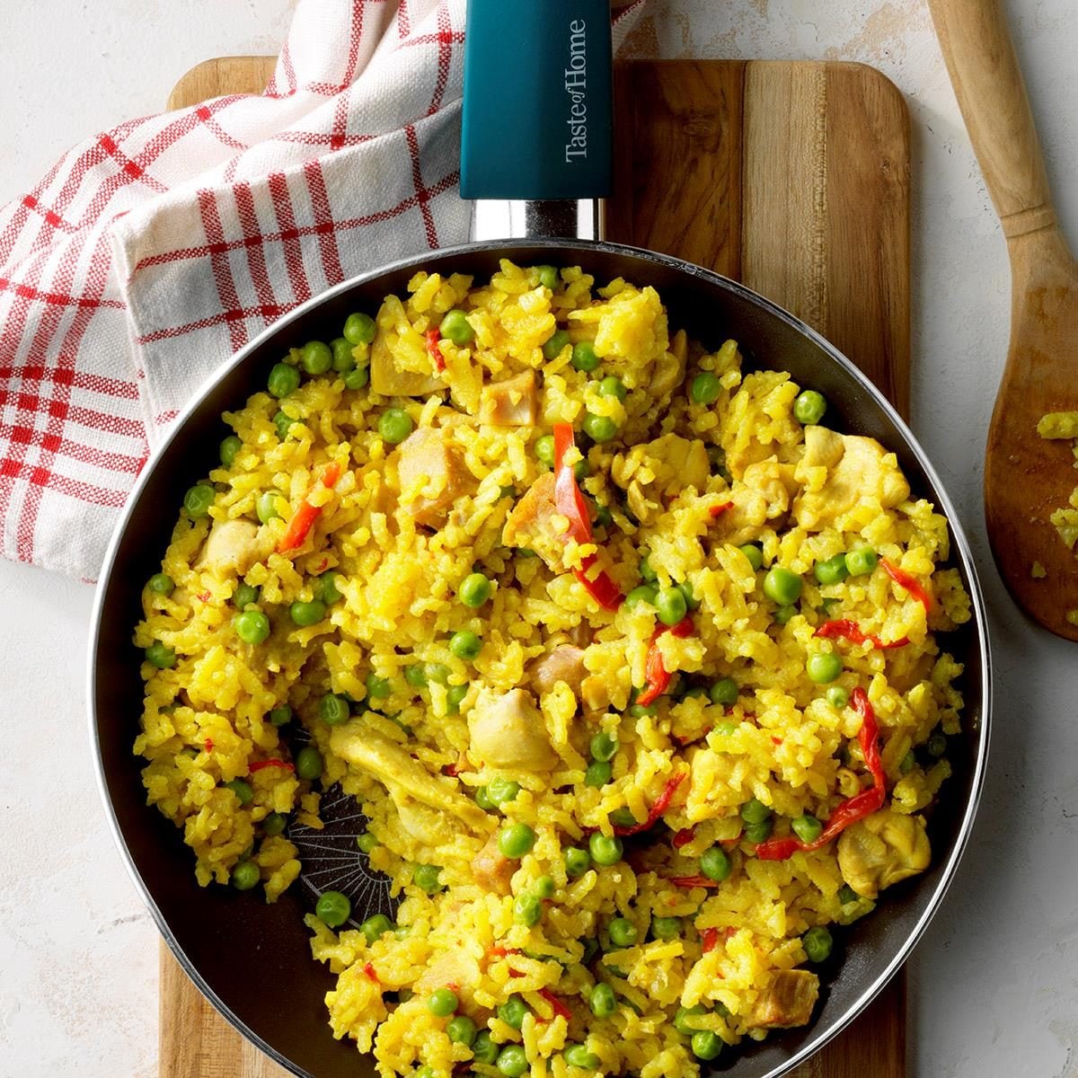 Saffron-Infused Chicken and Rice Paella with Roasted Red Peppers