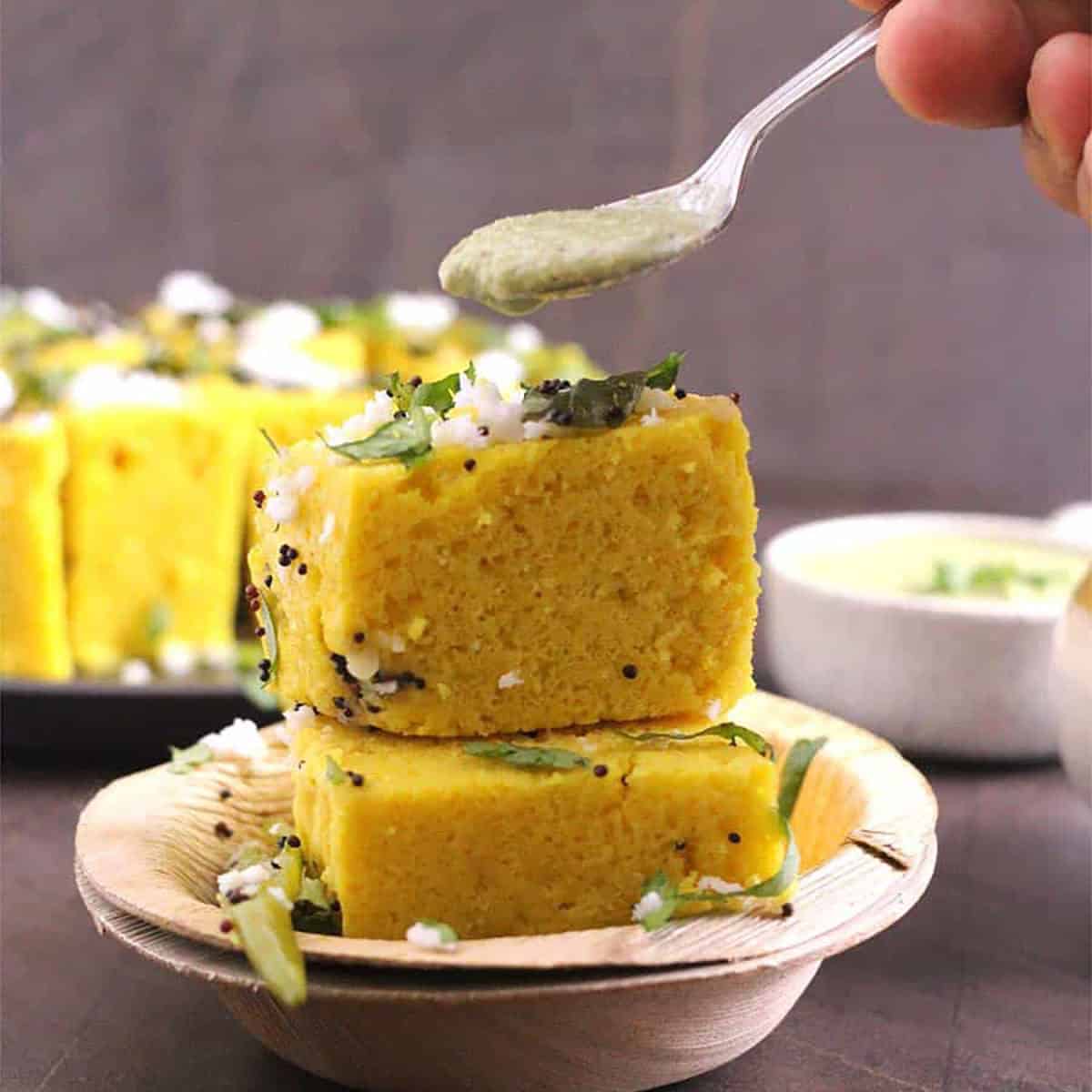 Tangy Gujarati Khaman Dhokla with Mustard and Green Chili Tempering