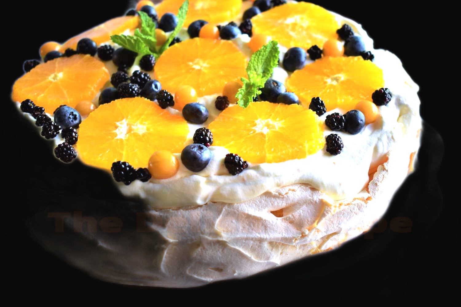 Honey-Orange Pavlova with Berries and Coconut
