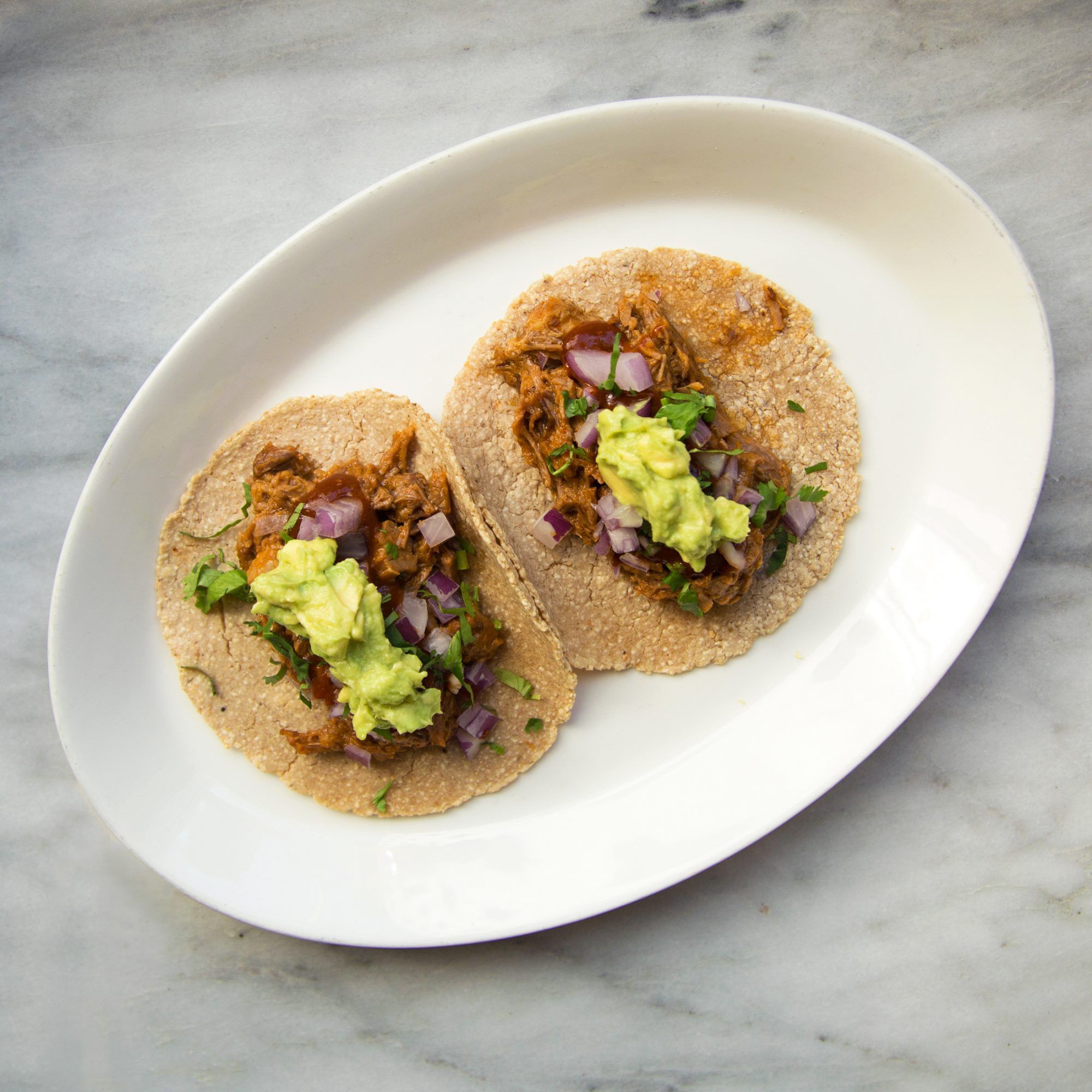 Gruene District Beer-Braised Brisket Tacos with Pickled Onions