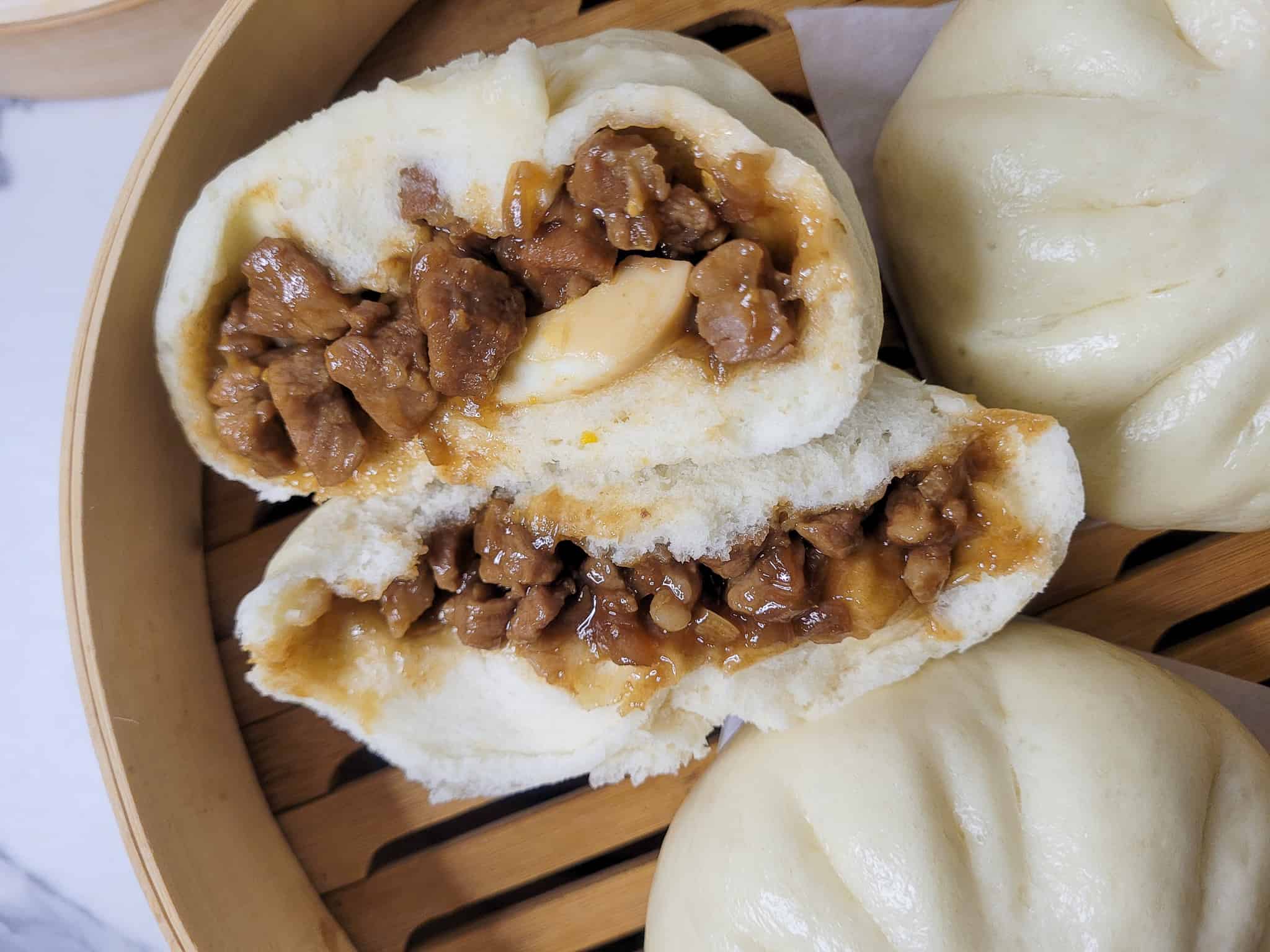 Steamed Pork Siopao Buns with Sweet Asado Filling