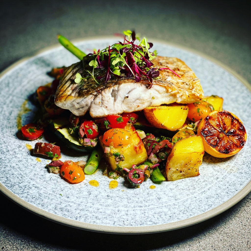 Tasmanian Pepperberry-Infused Barramundi with Macadamia Salsa