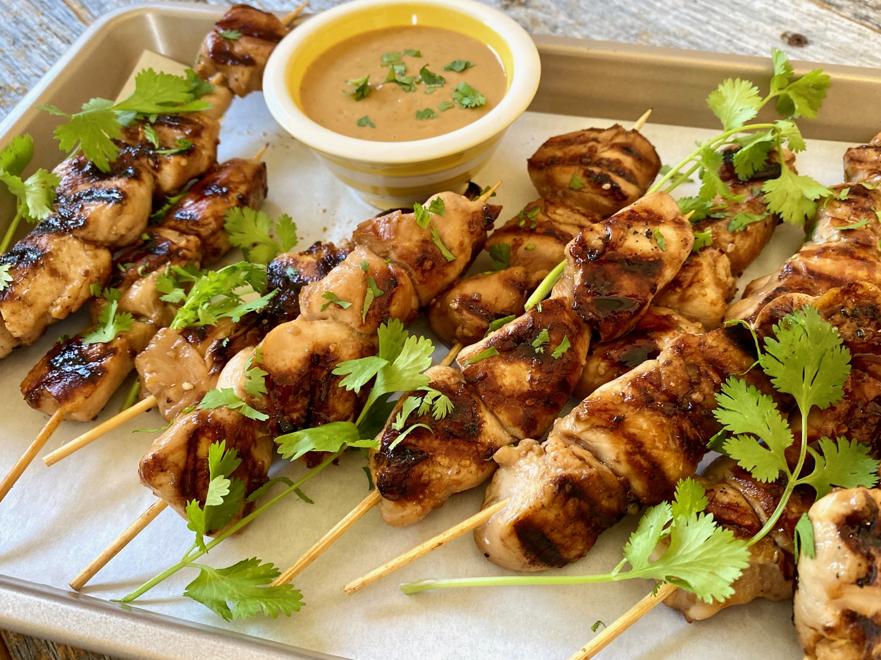 Grilled Jollof-Spiced Chicken Skewers with Tomato-Peanut Sauce