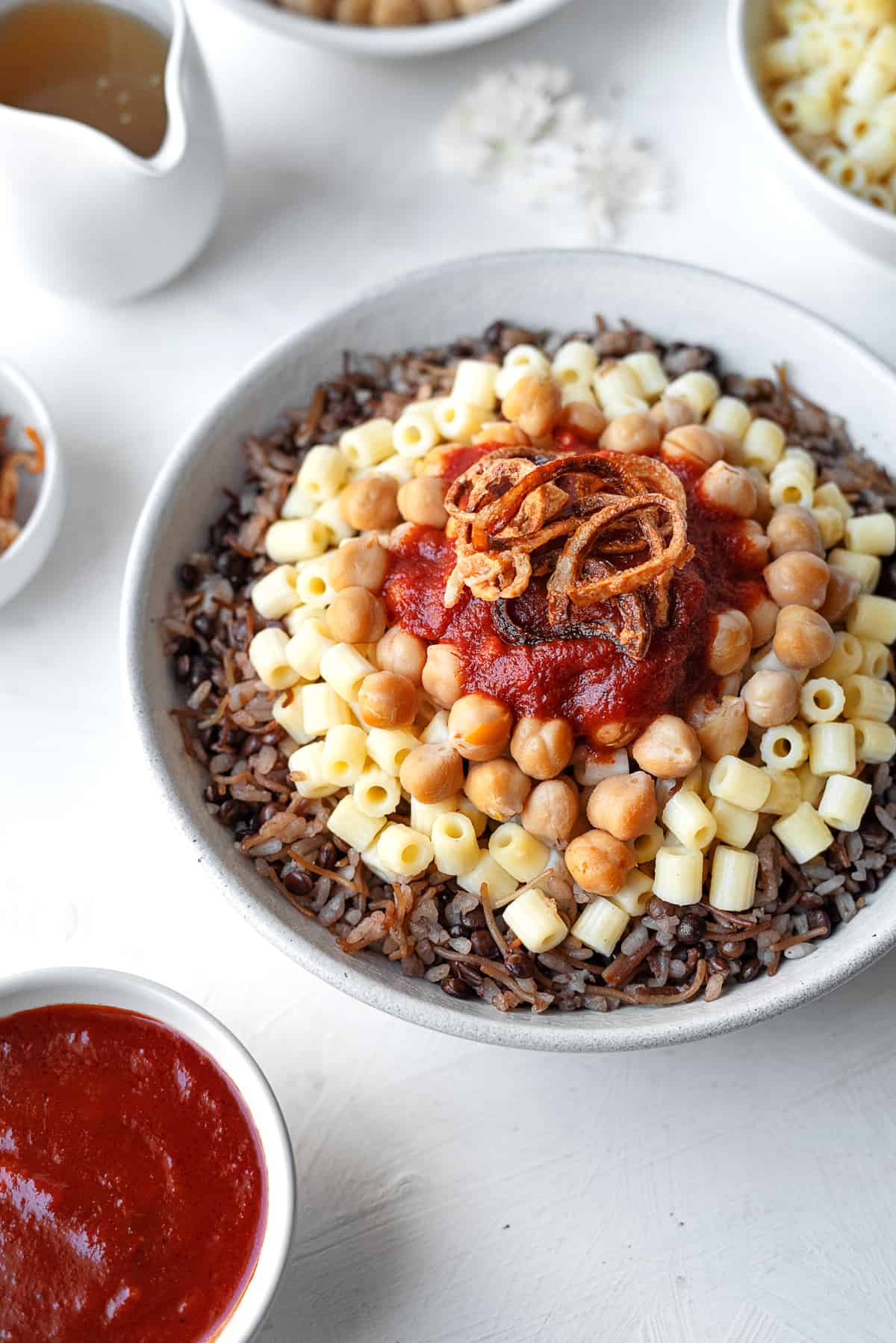 Pyramid-Inspired Egyptian Koshari with Tangy Tomato Sauce