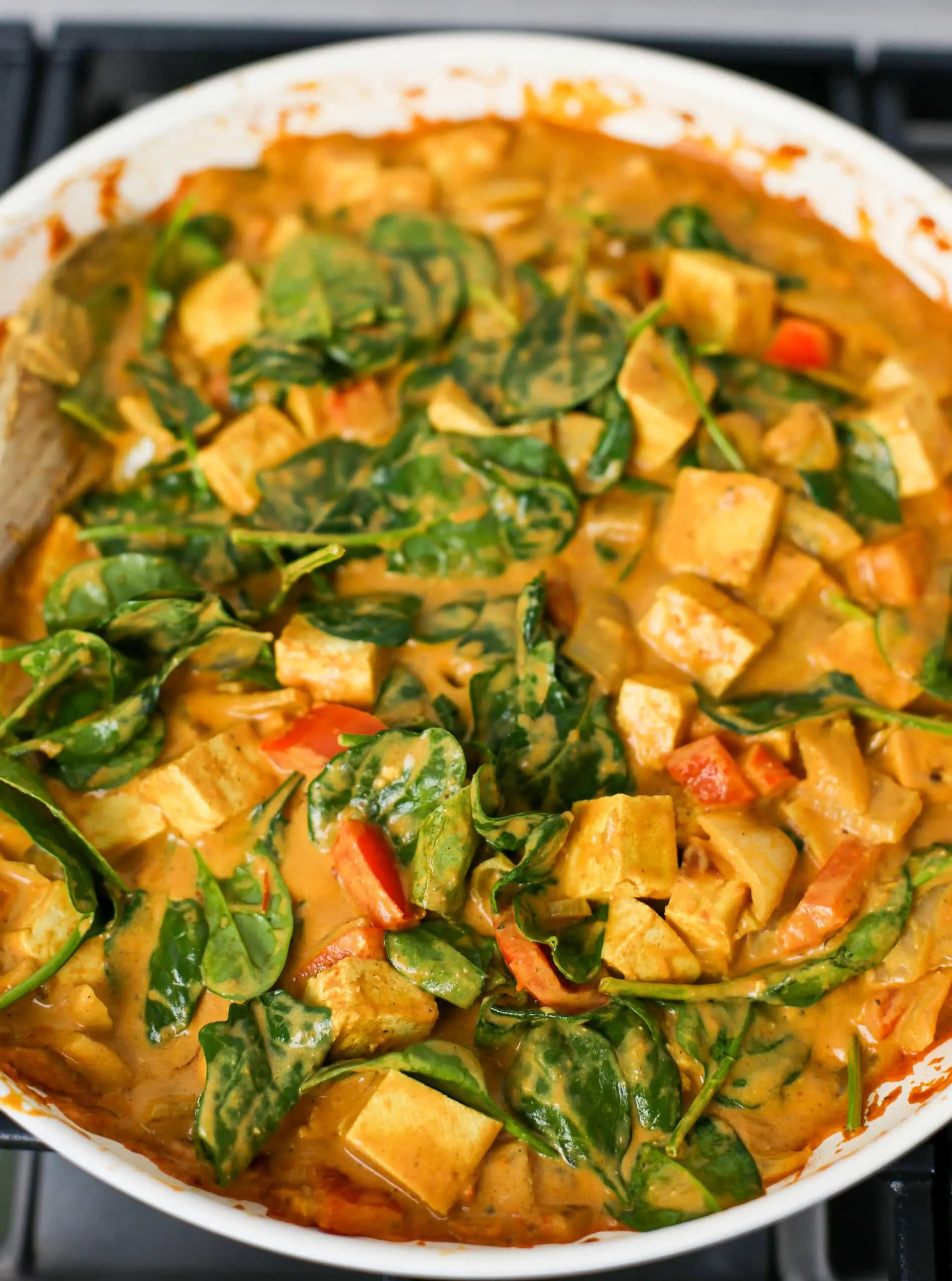 Heated Coconut Curry Soup with Tofu and Spinach