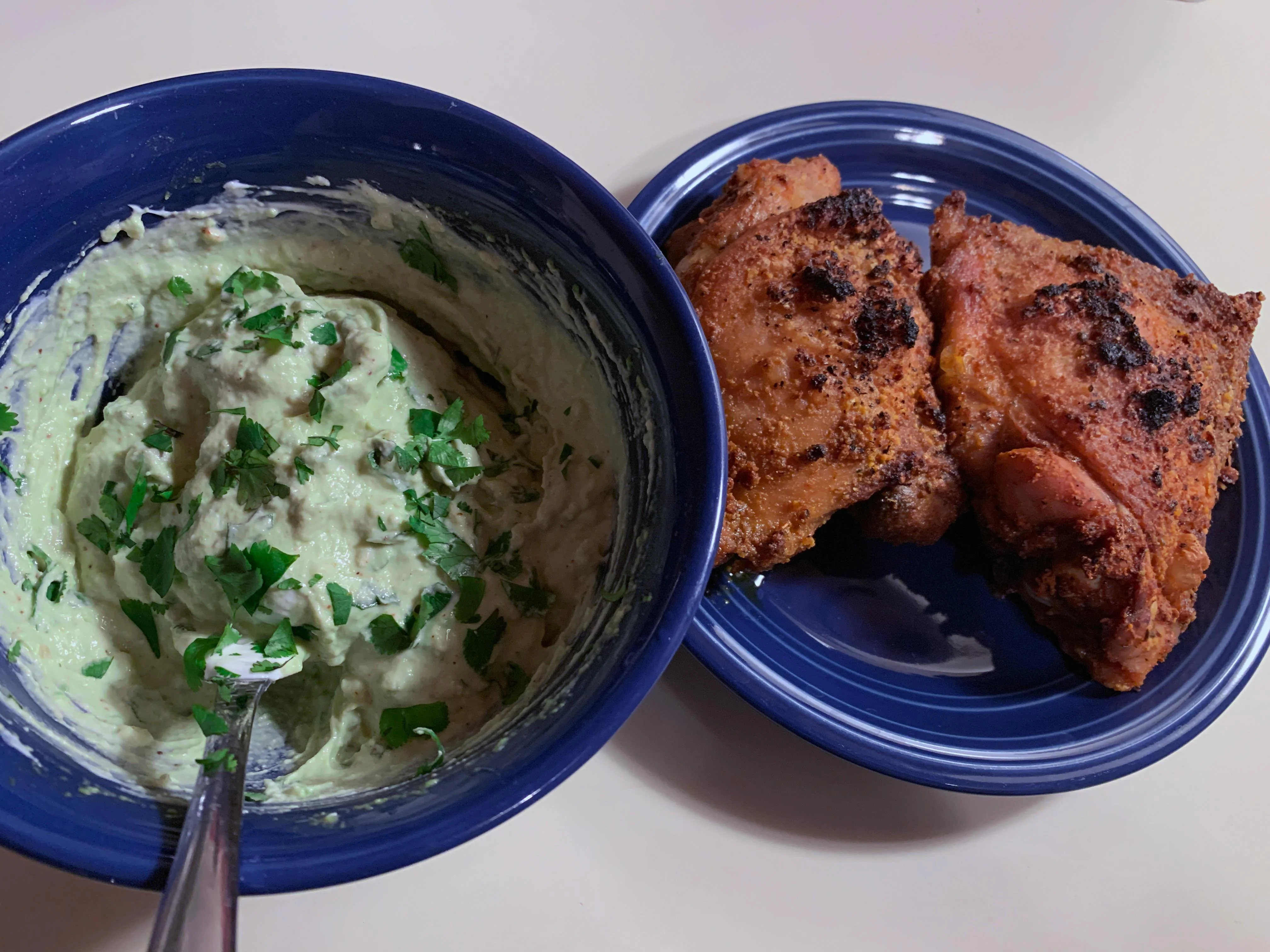 Crispy Herb-Crusted Chicken Thighs with Avocado Crema
