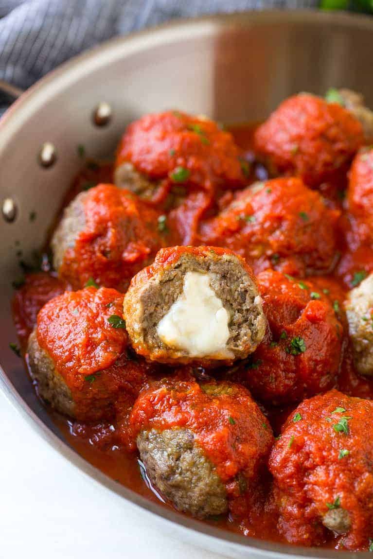 Cheese-Stuffed Meatballs in Spiced Tomato Sauce
