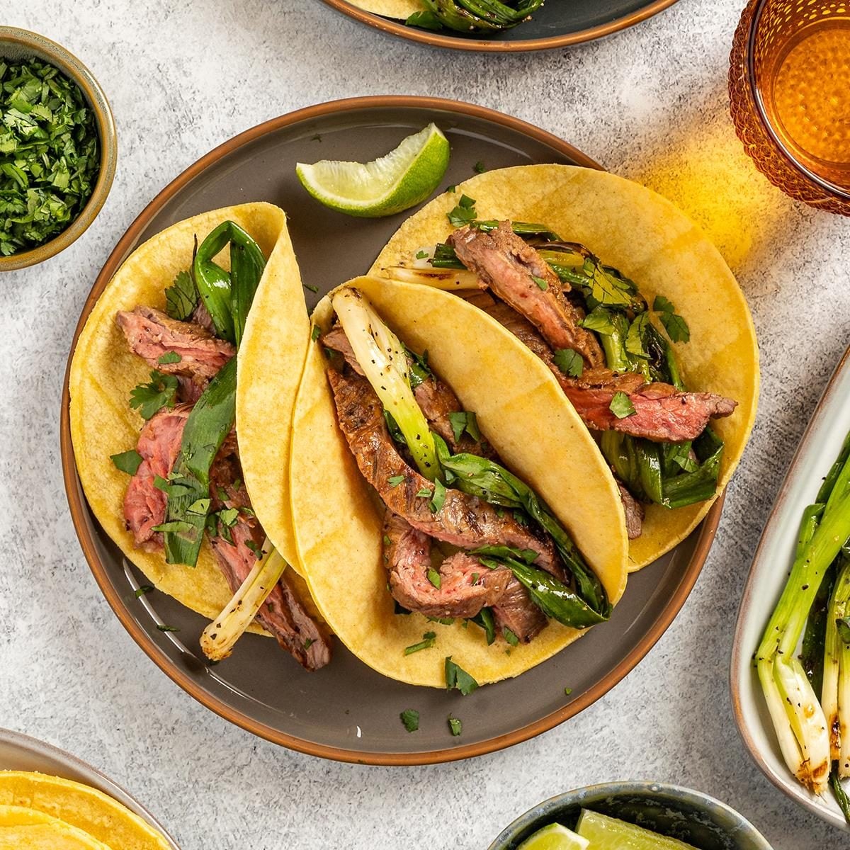 Smoky Charcoal-Grilled Brisket Tacos with Pickled Onion Salsa