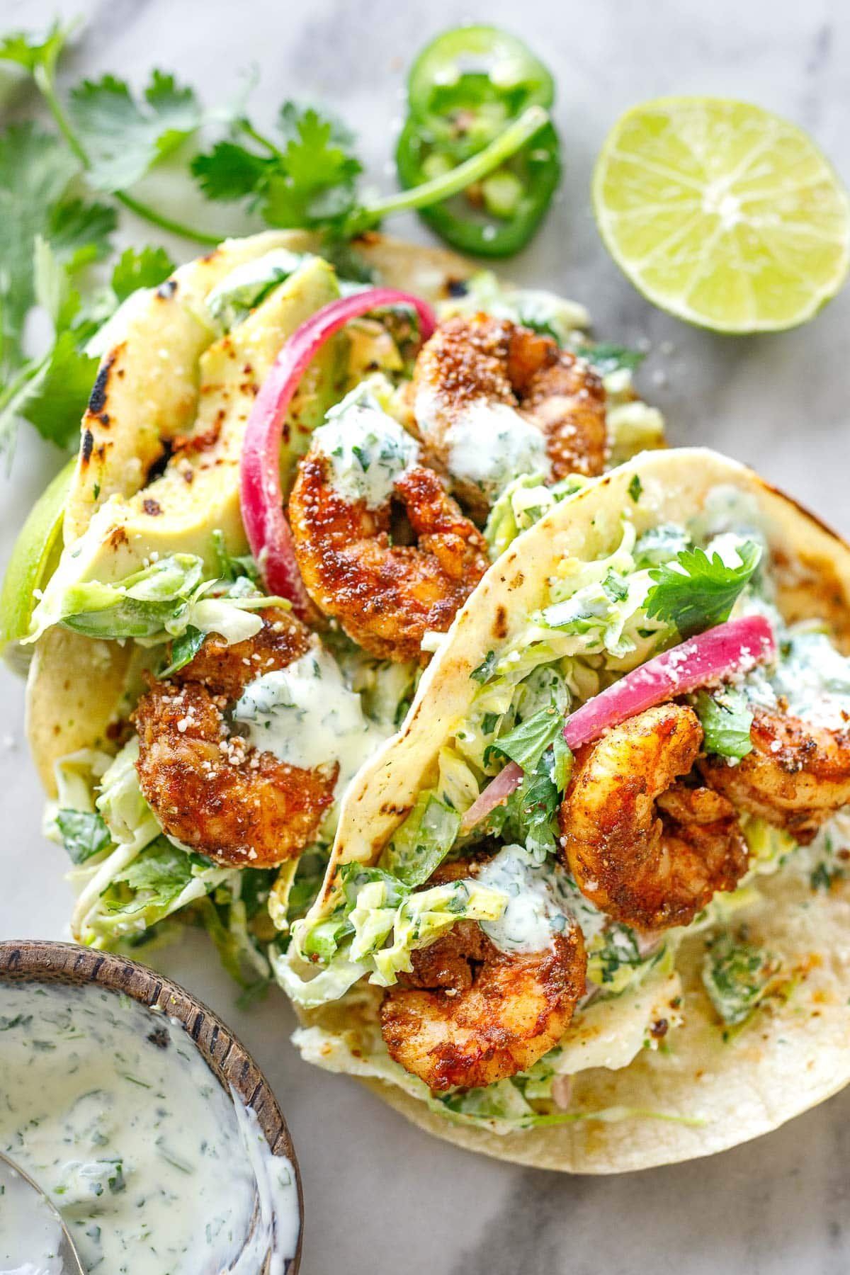 Sautéed Shrimp Tacos with Avocado Lime Crema and Pickled Red Onions