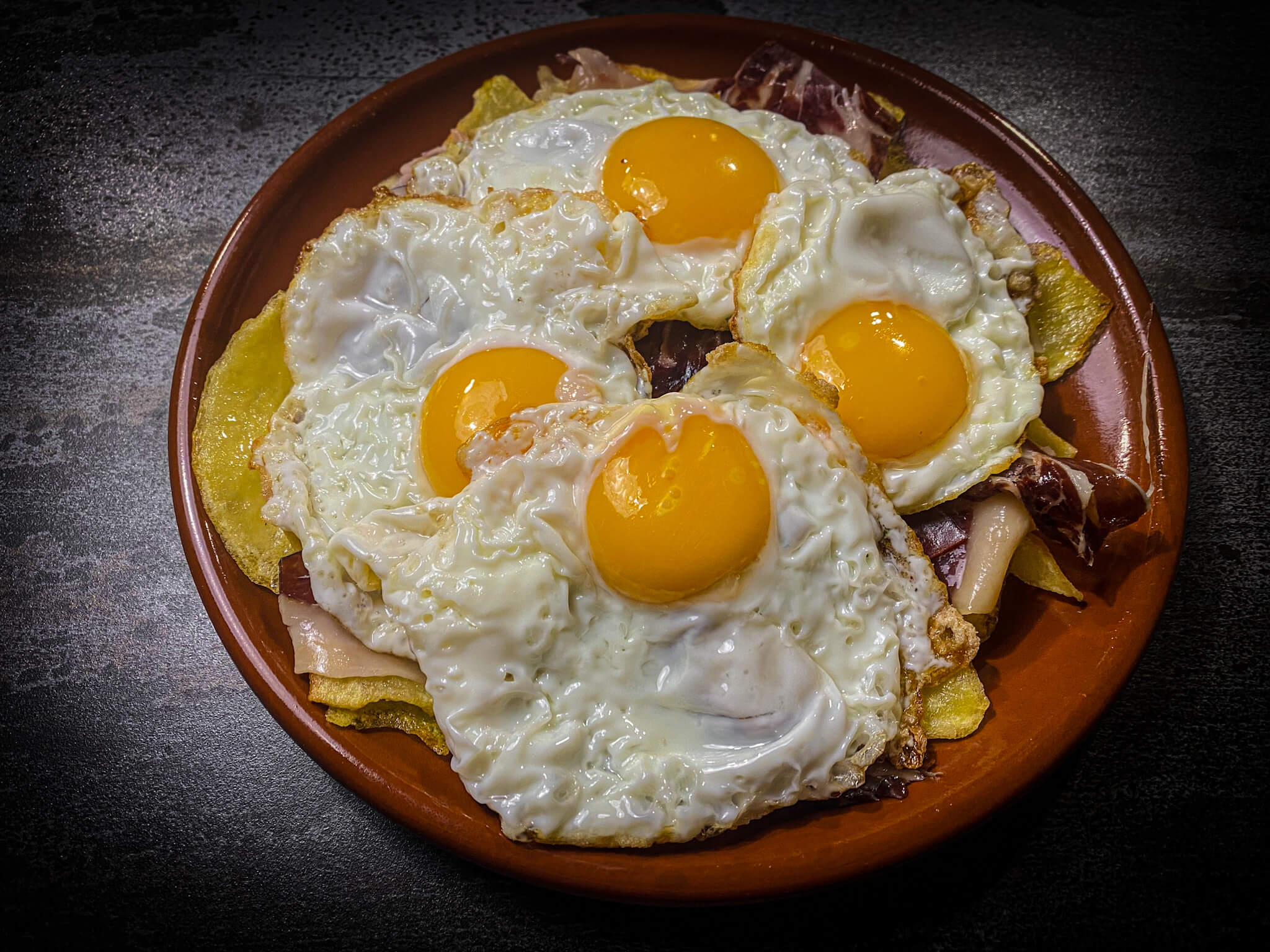 Huevos Rotos with Crispy Potatoes and Serrano Ham