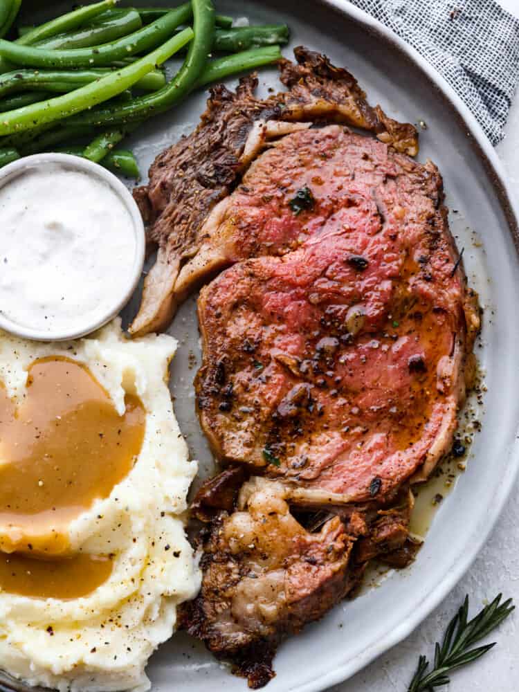 Rosemary-Smoked Rib Roast with Charred Garlic and Herb Butter