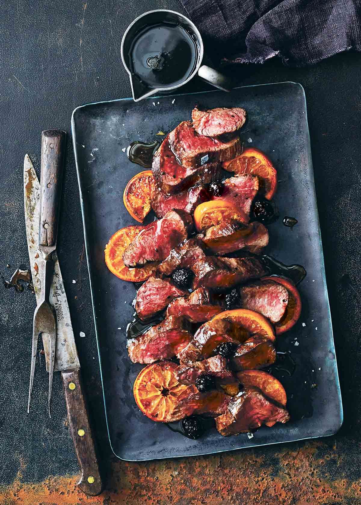 Red Wine Poached Venison with Spiced Berry Reduction