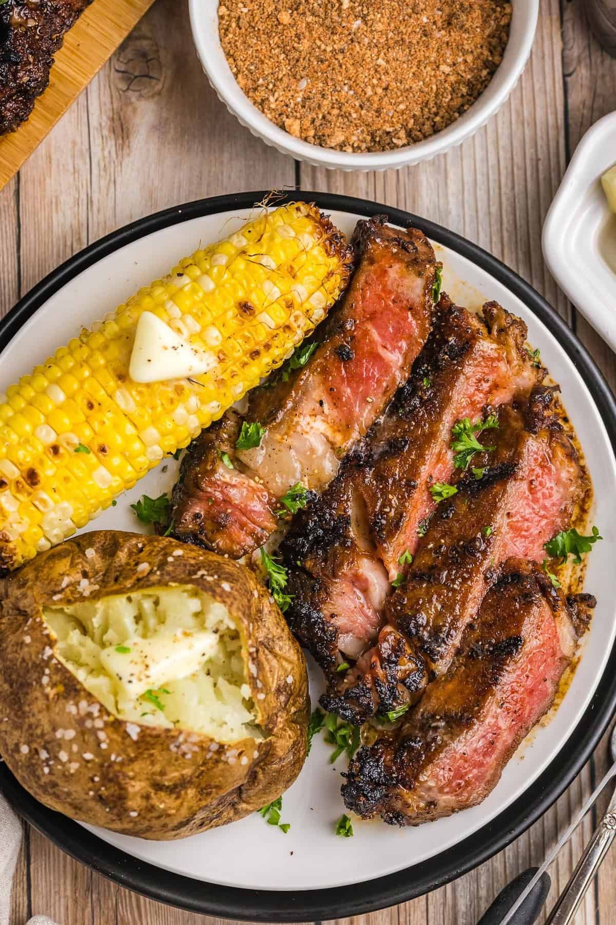 Grilled Gulfport-Style Ribeye with Garlic Butter and Charred Corn Salad