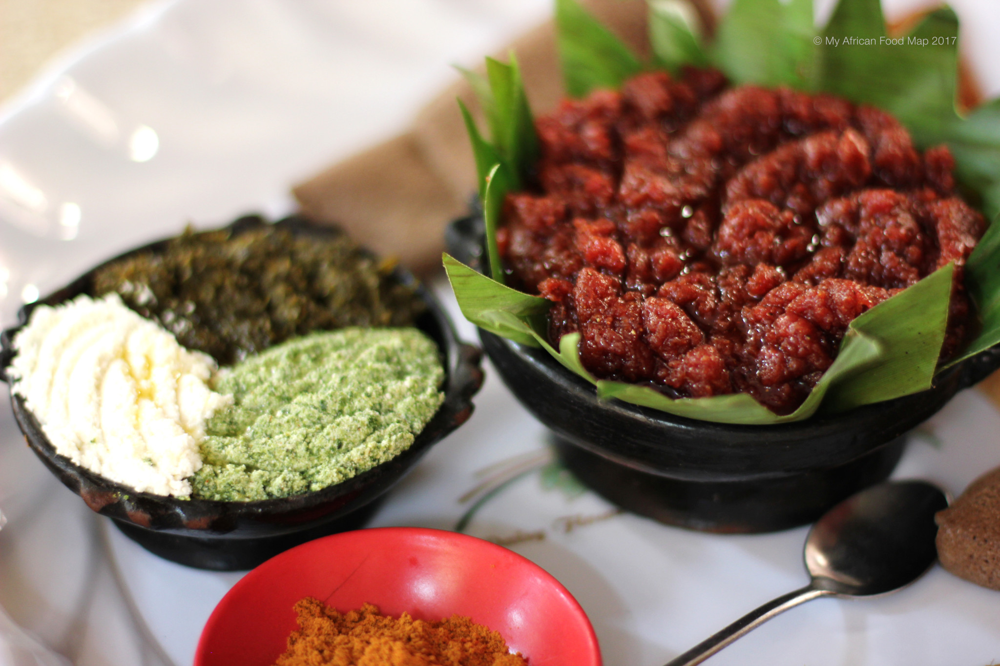 Cooked Ethiopian Kitfo with Spiced Butter and Collard Greens