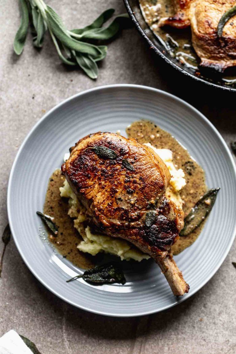 Pan-Fried Pork Chops with Apple Cider Reduction and Sautéed Spinach