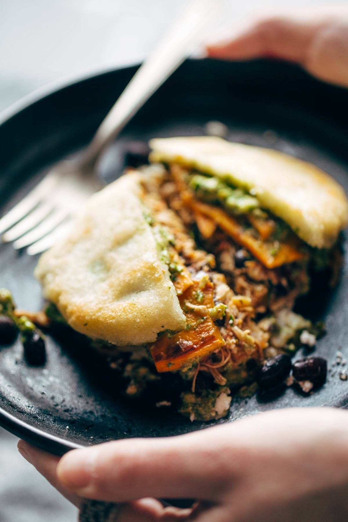 Grilled Arepas Stuffed with Slow-Cooked Shredded Beef and Guasacaca