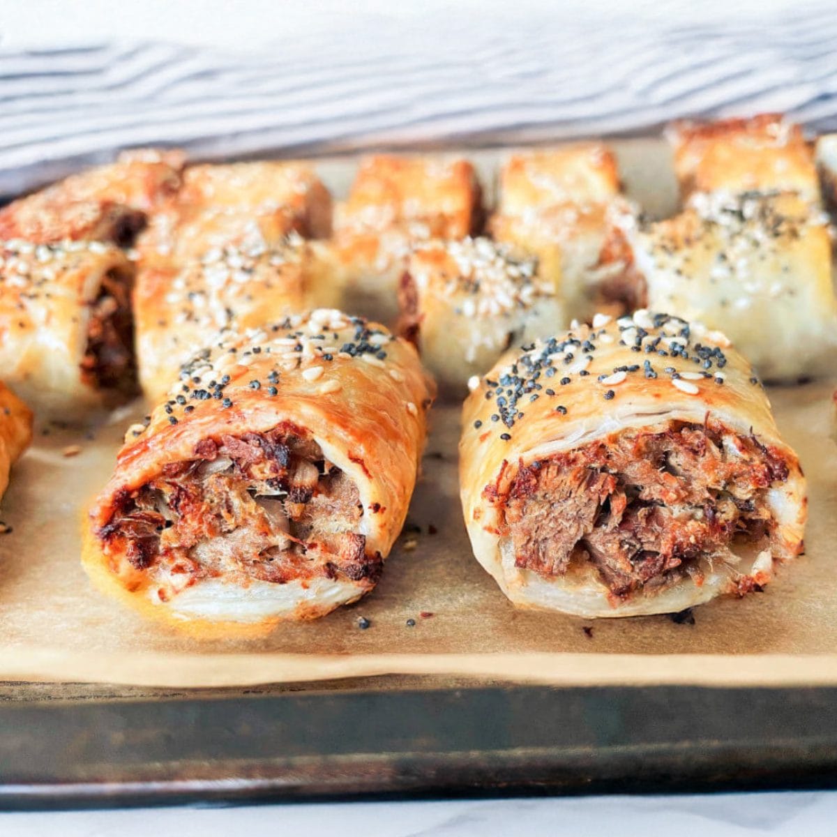 Oven-Baked Sausage Rolls with Puff Pastry and Seasoned Beef