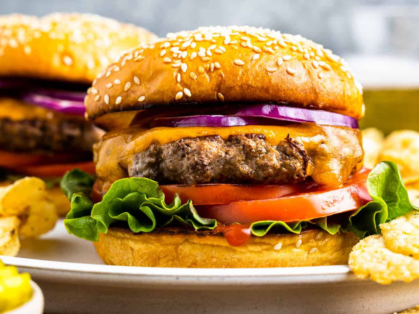 Pan-Seared Burger with Charred Onions and Smoked Cheddar