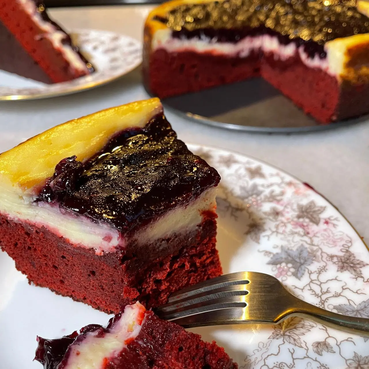 Layered Red Velvet and Blueberry Cheesecake Bars
