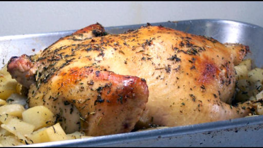 Herb-Infused Roast Chicken with Potatoes