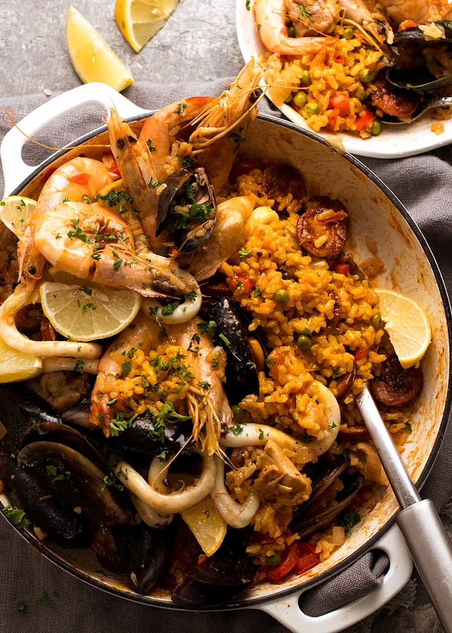 Saffron-Infused Seafood Paella with Romesco Sauce