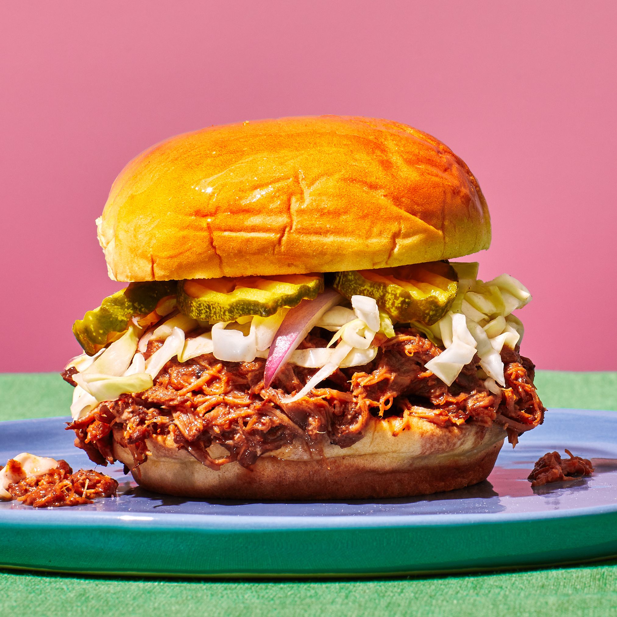 Wood-Smoked Pulled Pork Sandwiches with Tangy Slaw