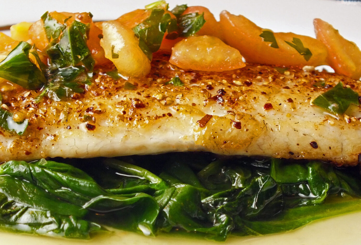 Pan-Seared Sea Bass with Citrus Herb Sauce and Wilted Spinach