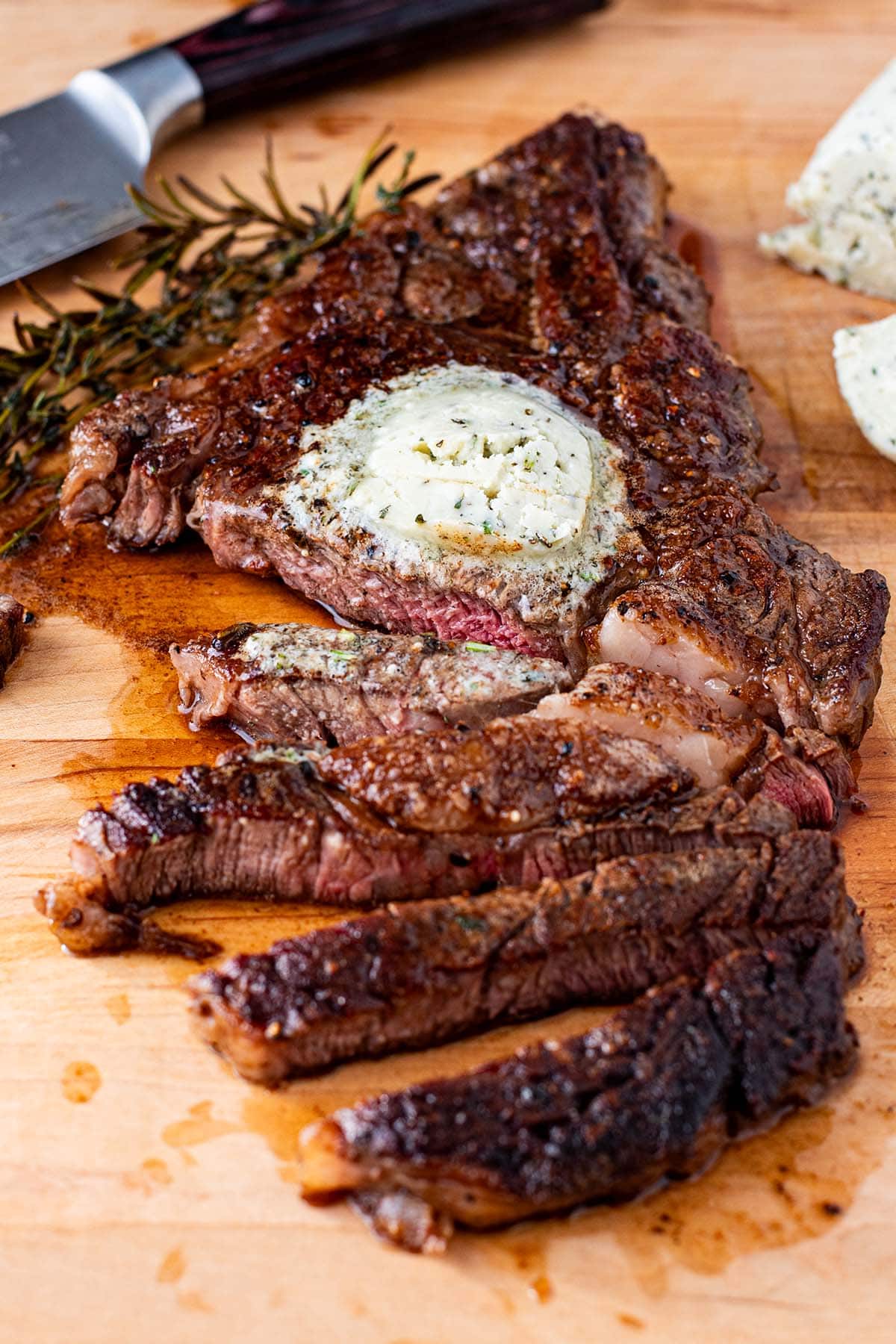 Pan-Seared Ribeye with Blue Cheese Butter and Roasted Red Pepper Sauce