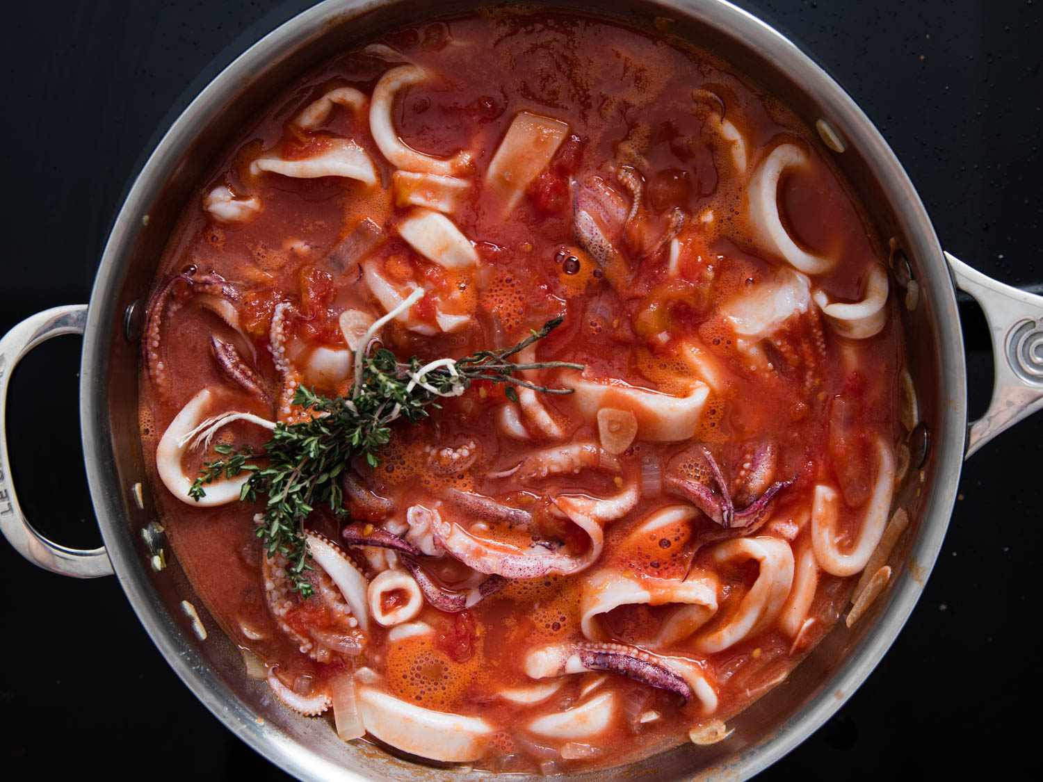 Braised Squid with Harissa, Tomato, and Green Olives