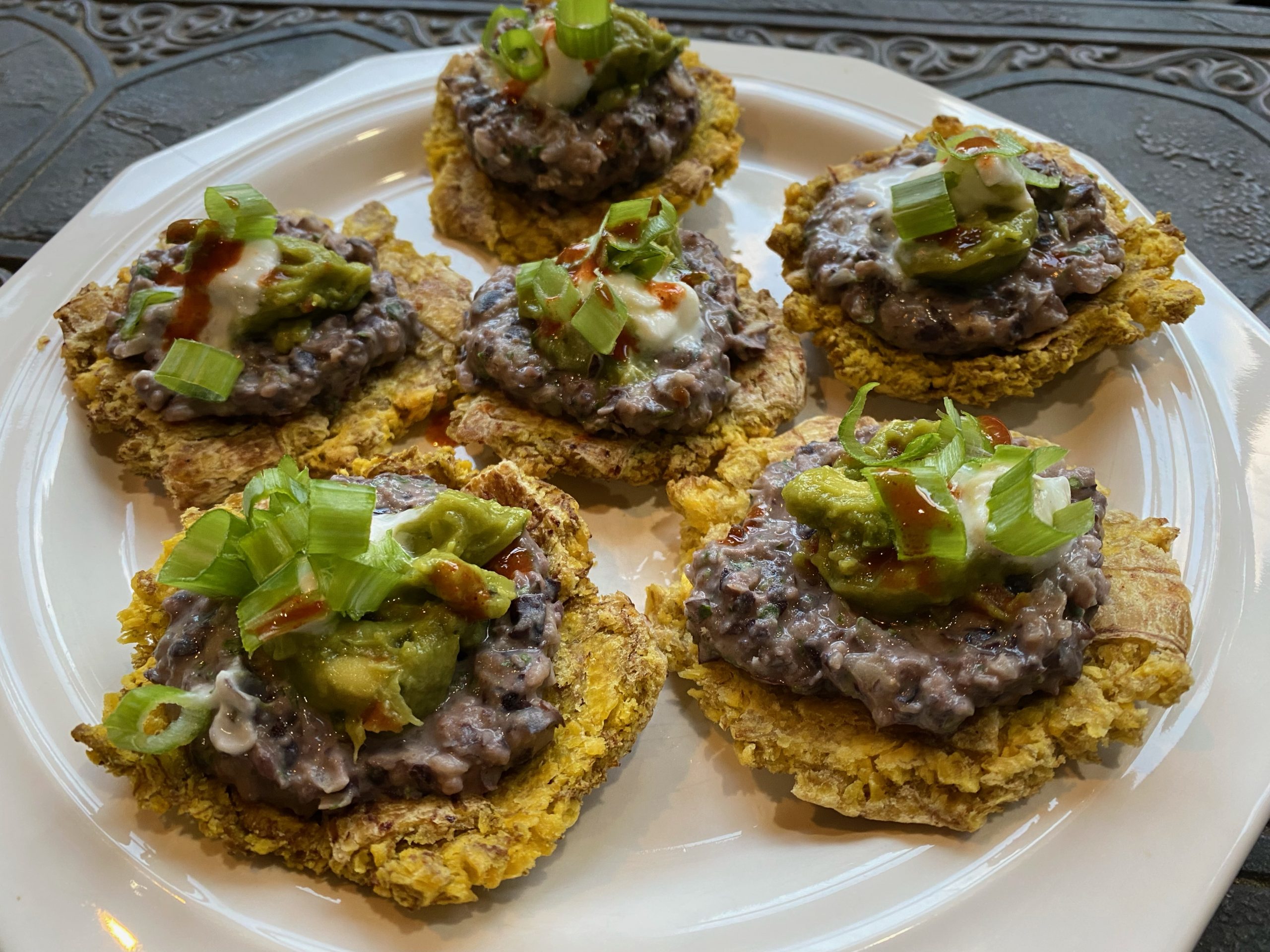 Crispy Patacones with Garlicky Black Bean Dip