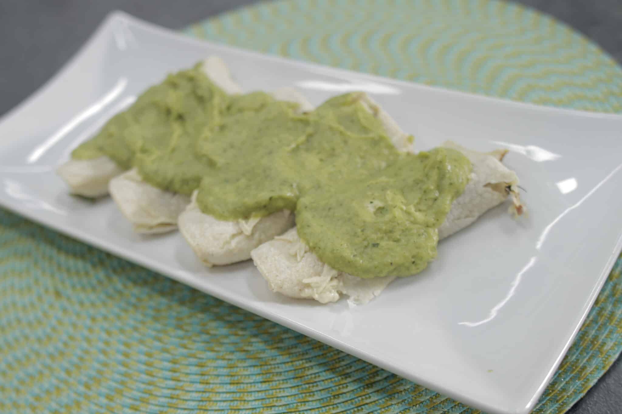 Latin American Black Bean and Sweet Potato Enchiladas with Avocado Crema