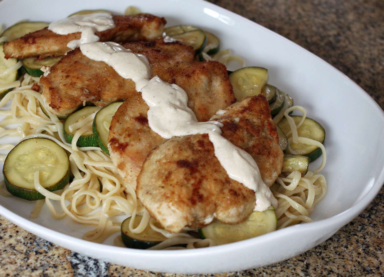 Herb-Crusted Chicken & Zucchini Noodles with Lemon-Garlic Sauce