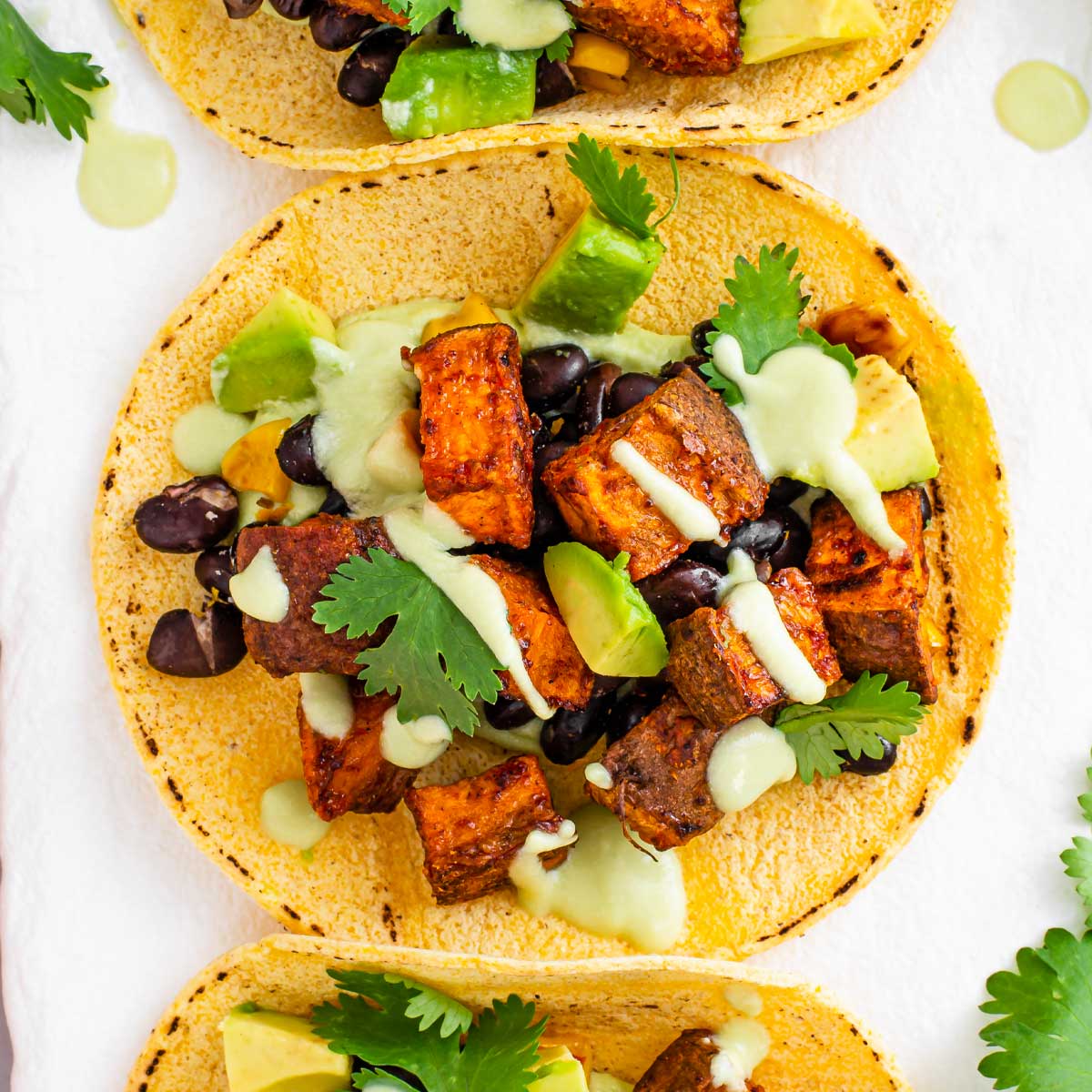 Black Bean and Sweet Potato Tacos with Avocado Crema