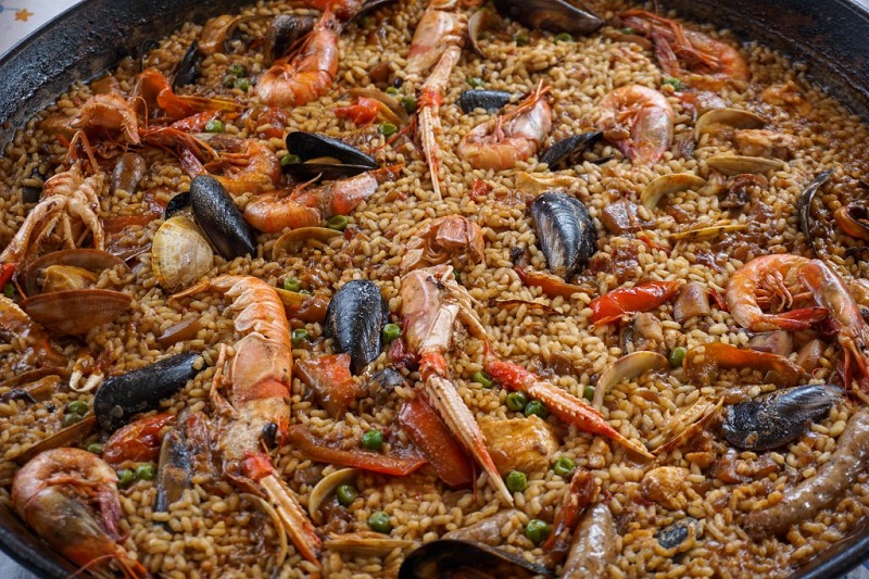 Saffron-Infused Chicken Paella with Bomba Rice