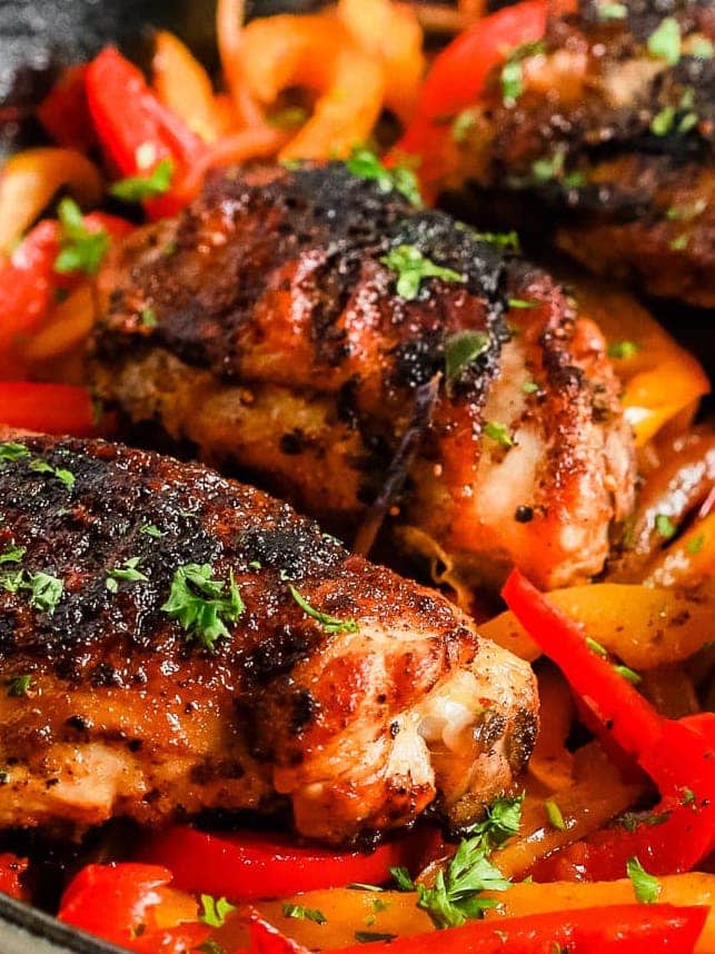 Spanish Herb-Rubbed Chicken Thighs with Roasted Bell Peppers and Carrots
