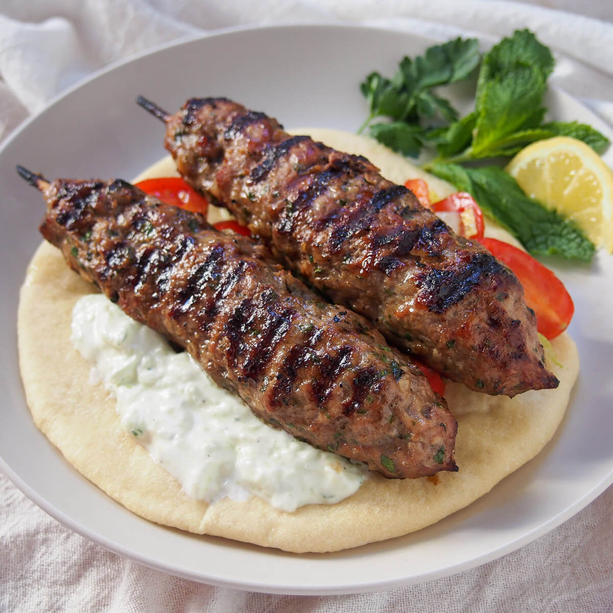 Harissa-Spiced Lamb Kofta with Charred Flatbread