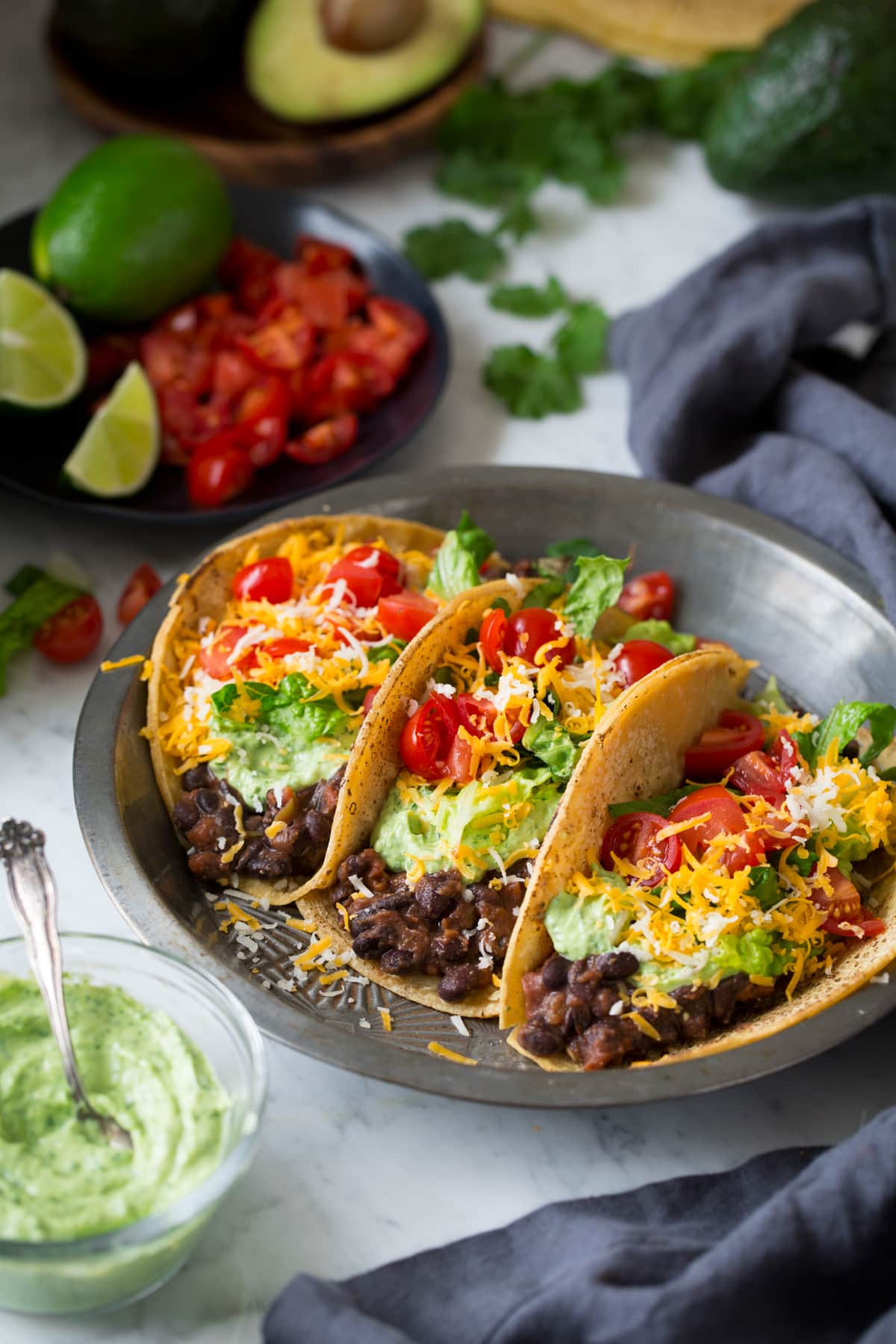 Smoky Maple-Roasted Sweet Potato & Black Bean Tacos with Avocado Crema
