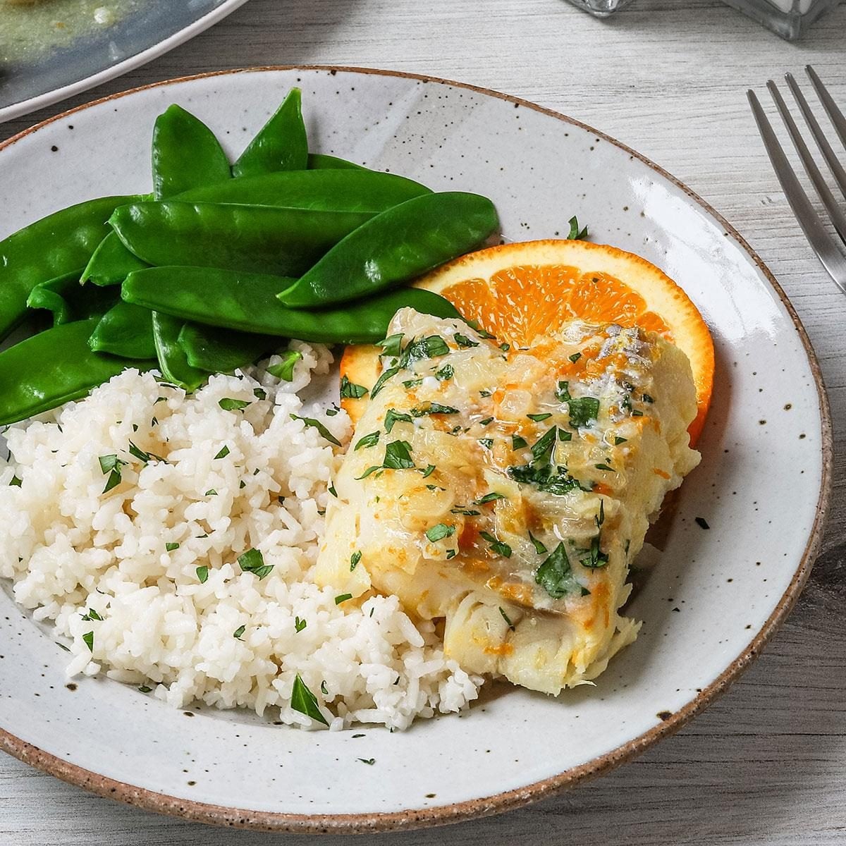 Citrus-Glazed Cod with Edible Flower Garnish