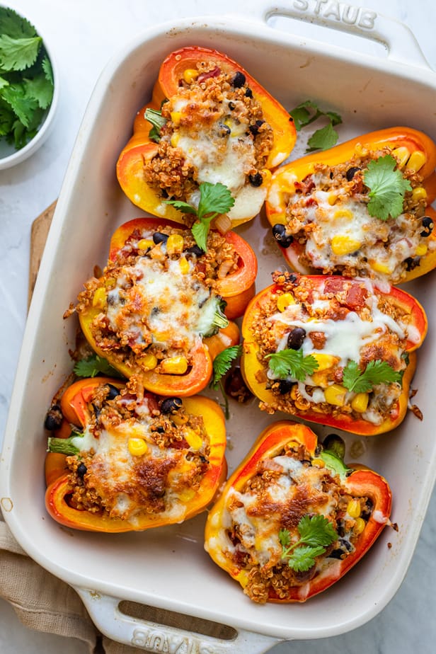 Quinoa and Chickpea Stuffed Peppers with Herbed Tomato Sauce